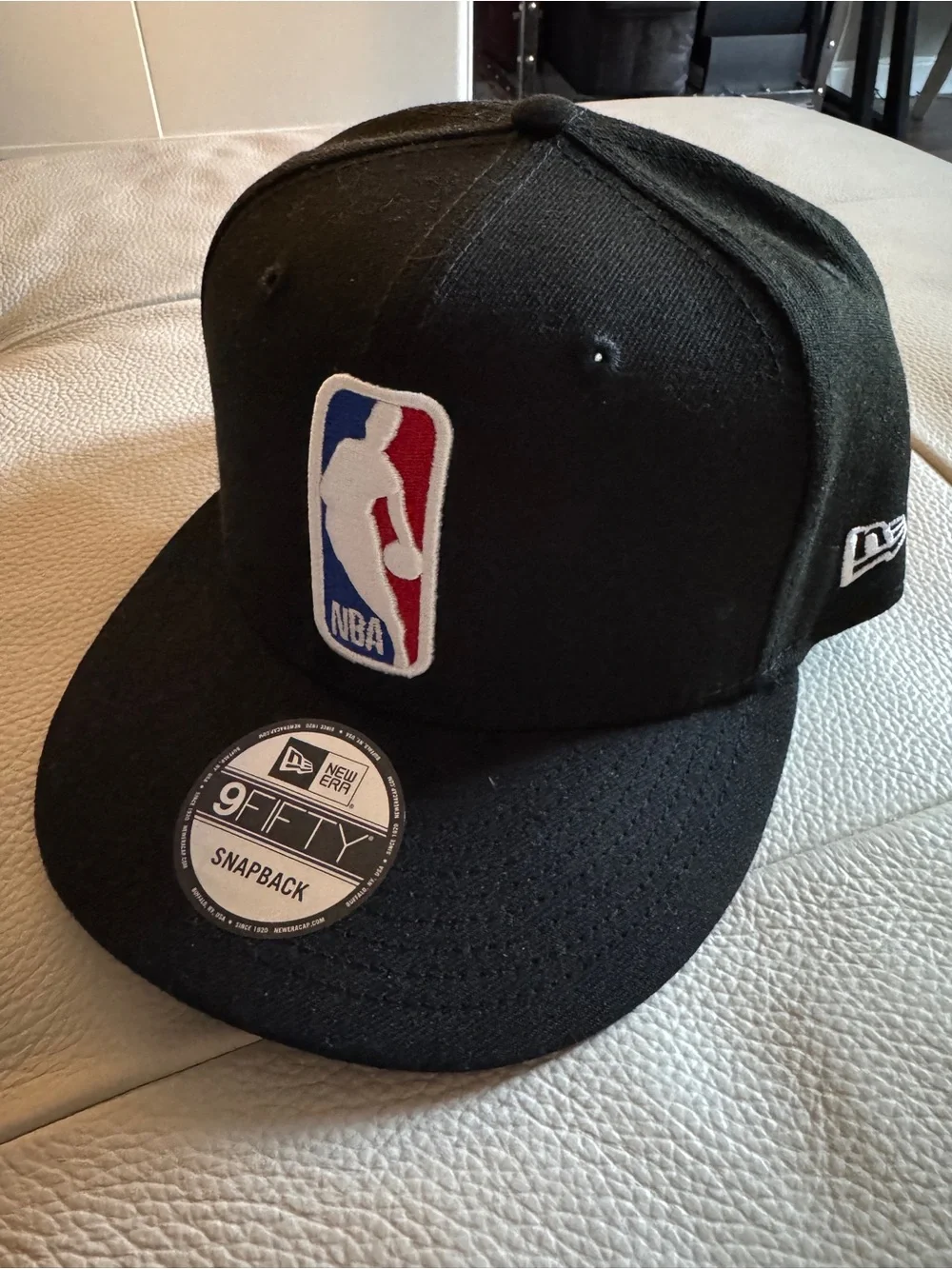New Era Black NBA Logo Snapback Cap with Red & Blue Patch